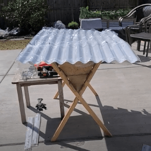using a raised surface to assemble vego garden bed panels