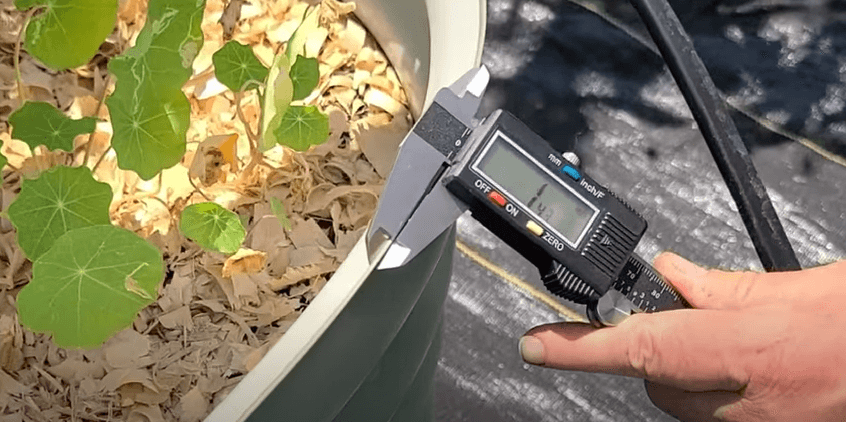Measuring the thickness of the raised garden bed panels